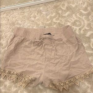 Beige shorts with lace trim